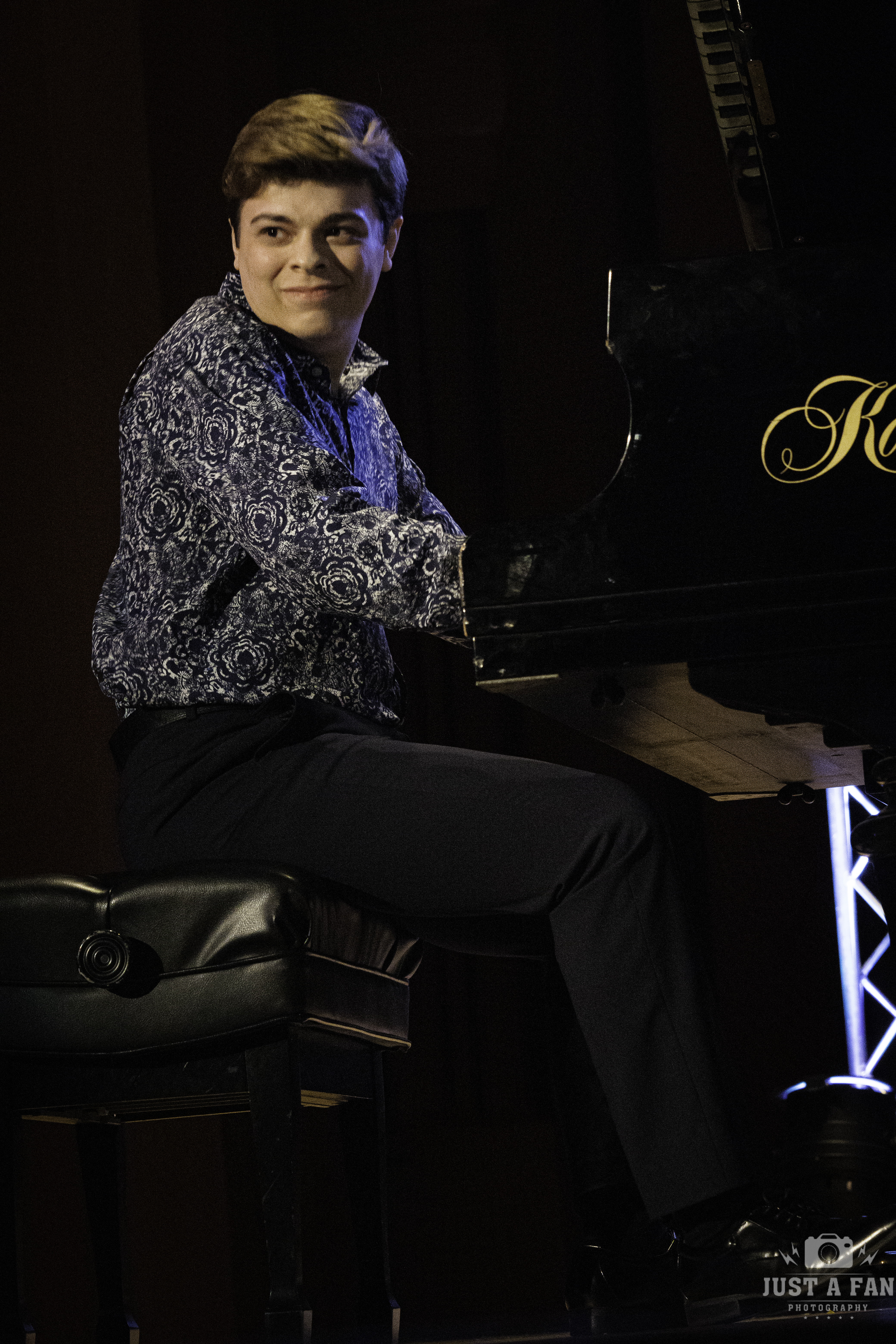 Michael Rainwater under spotlight during live performance